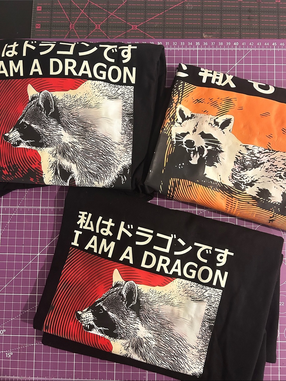 A bundle of three racoon graphic tees